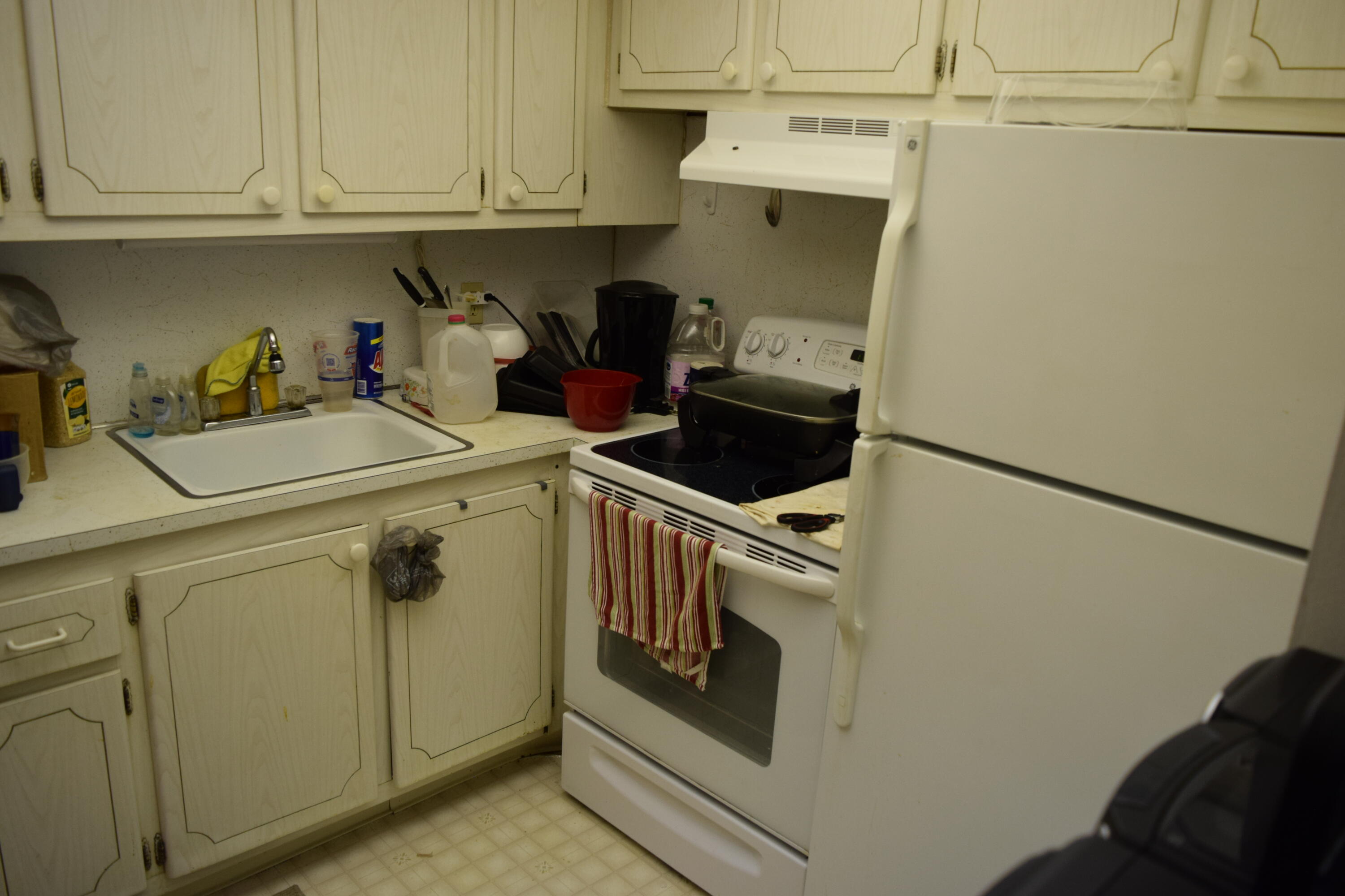 58 Sussex C, Unit C West Palm Beach, FL 33417 - Photo 7 of 22 a utility room with dryer and washer