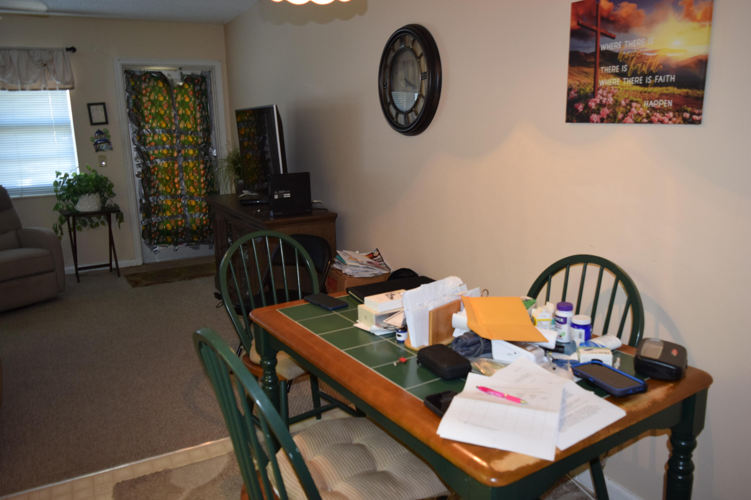 58 Sussex C, Unit C West Palm Beach, FL 33417 - Photo 8 of 22 a view of a dining room with furniture and wooden floor