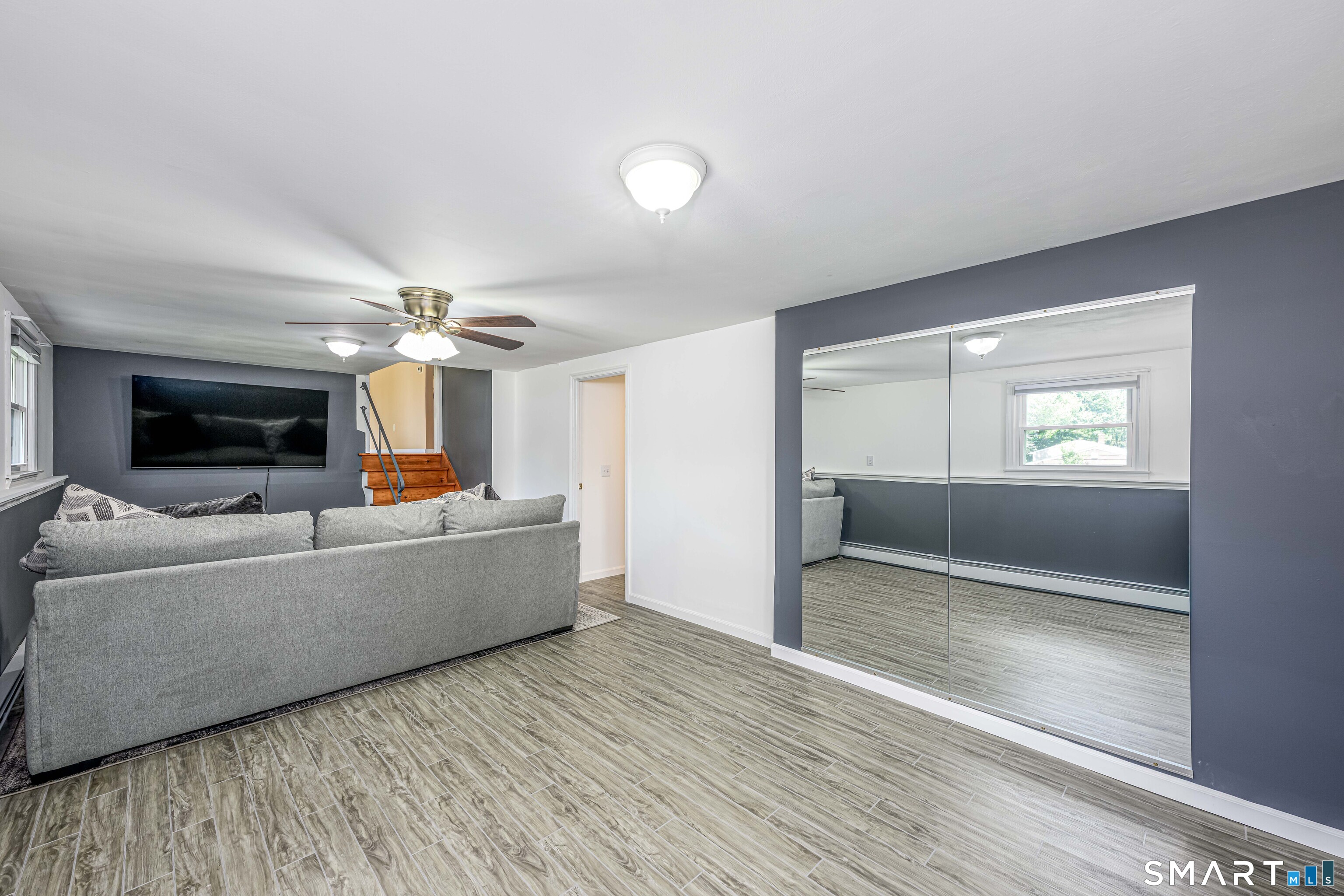 91 Nicholas Road Wallingford, CT 06492 - Photo 16 of 31 Lower-level Family Room. Entire level waterproofed in 2025!