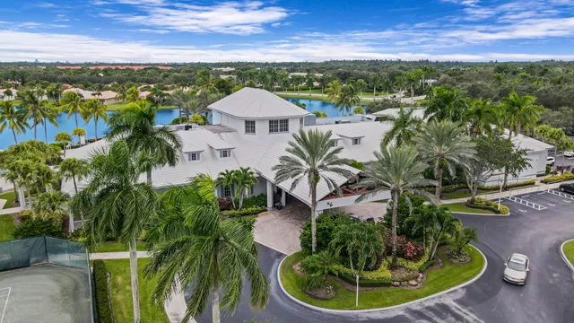 an aerial view of a house with garden space and street view