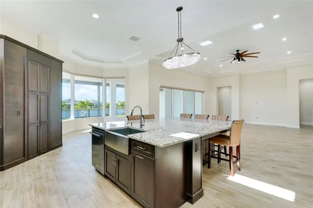 a kitchen with sink cabinets and wooden floor