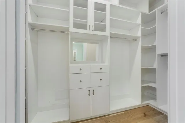 a view of an empty walk in closet