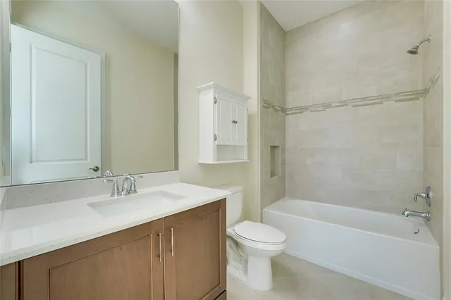 a bathroom with a sink a toilet and bathtub