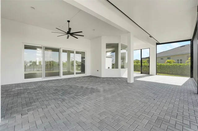 a view of an empty room with glass door