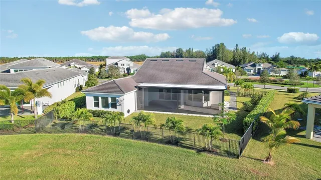 a front view of a house with yard and green space