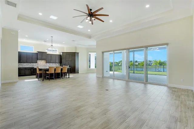 a view of a livingroom with furniture and a large window