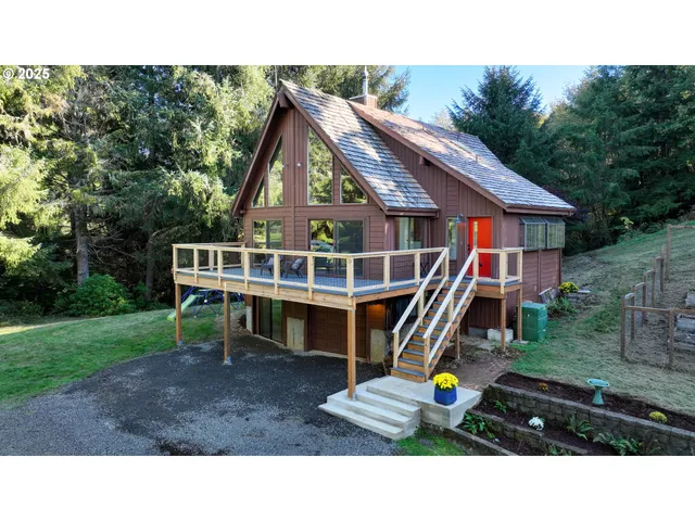 a aerial view of a house with swimming pool outdoor seating