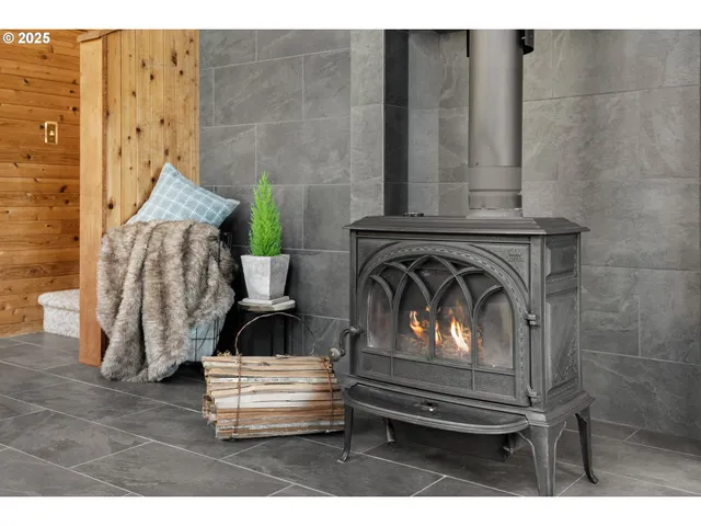 a view of fireplace with wooden floor