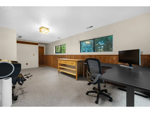 a view of house with swimming pool outdoor seating