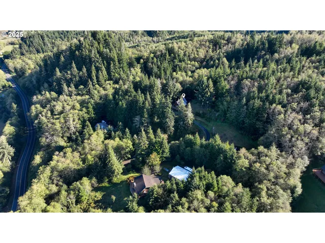 a front view of a house with a yard and balcony