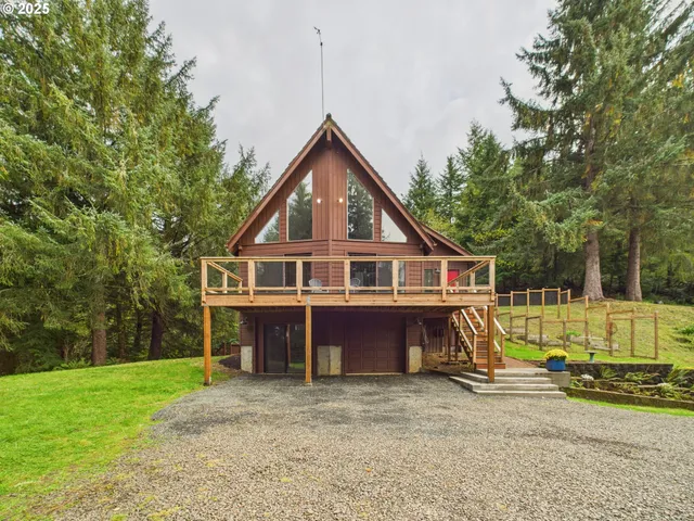 a view of a deck with a floor to ceiling window with wooden floor