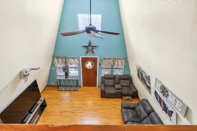 a view of an entryway with wooden floor