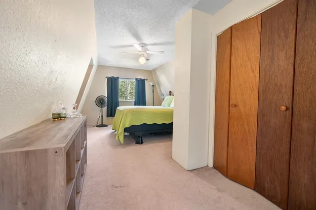 a bedroom with a bed and a table