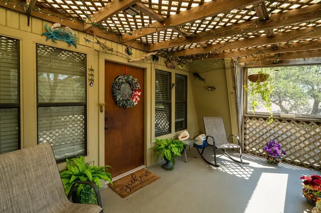 a front view of a house with outdoor seating
