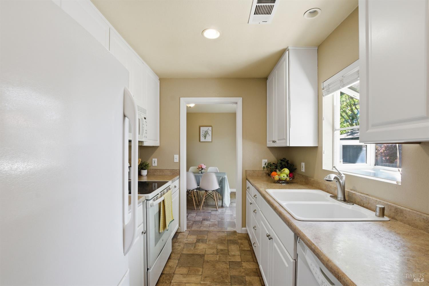 2015 Locust Street Napa, CA 94559 - Photo 30 of 54 a kitchen with a sink and a stove top oven