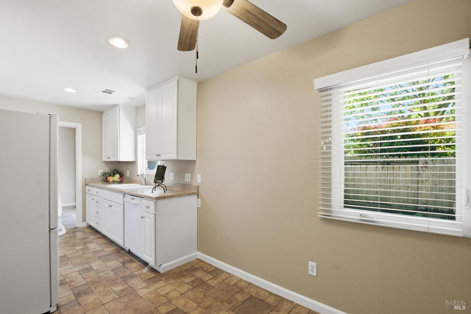 2015 Locust Street Napa, CA 94559 - Photo 33 of 54 a kitchen with stainless steel appliances granite countertop a stove a sink and a refrigerator with wooden floors