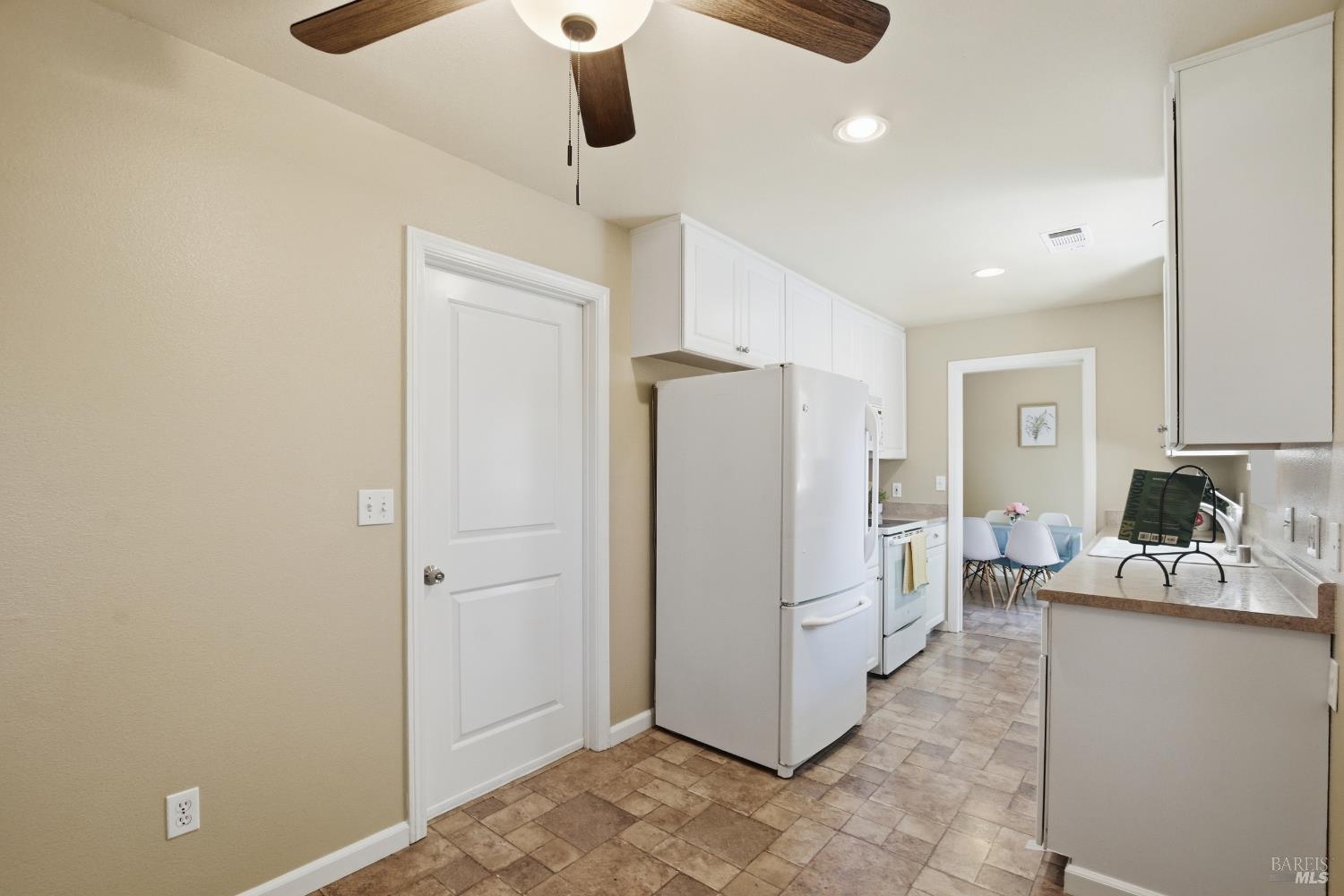 2015 Locust Street Napa, CA 94559 - Photo 34 of 54 a kitchen with refrigerator and cabinets