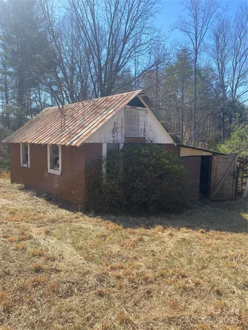 a house with trees in the background