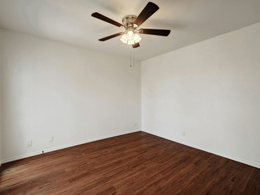 913 Sirocco Drive, Unit A & B Austin, TX 78745 - Photo 18 of 39 a view of an empty room with wooden floor