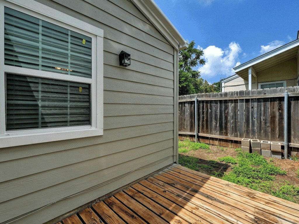 913 Sirocco Drive, Unit A & B Austin, TX 78745 - Photo 21 of 39 a view of a backyard with a door and wooden floor
