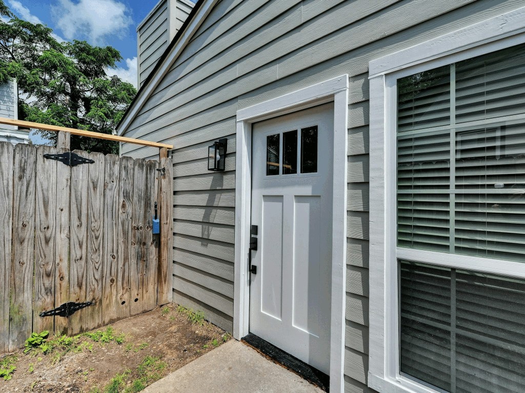 913 Sirocco Drive, Unit A & B Austin, TX 78745 - Photo 22 of 39 a view of a house with a door and wooden wall