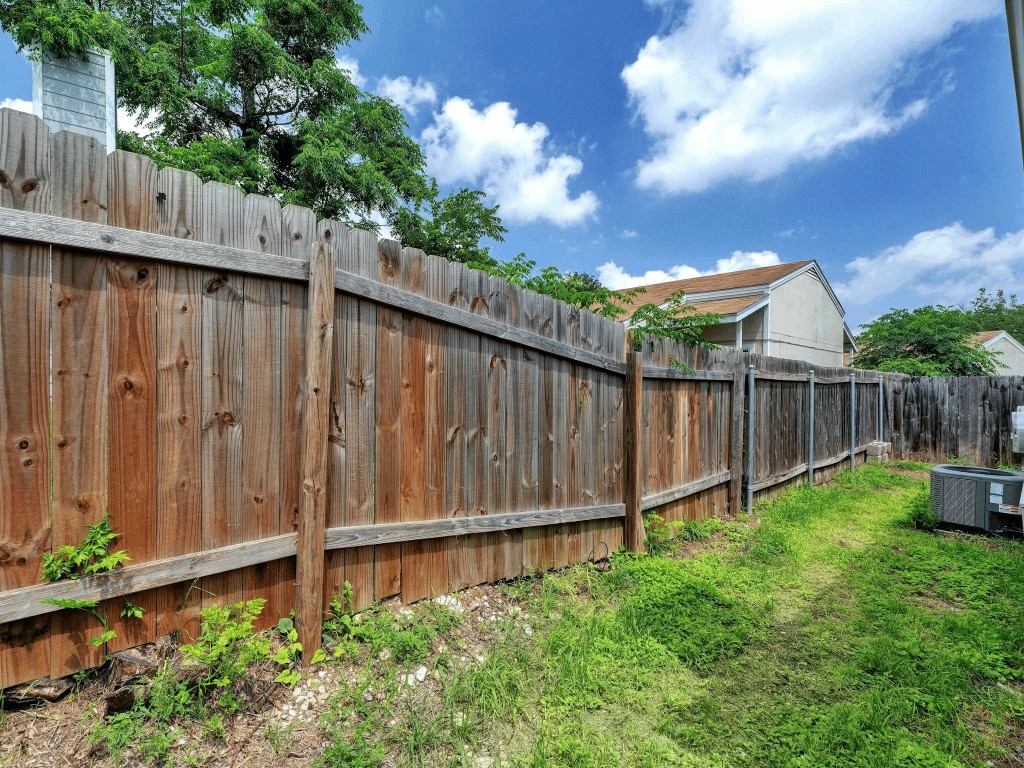 913 Sirocco Drive, Unit A & B Austin, TX 78745 - Photo 23 of 39 a view of a backyard with wooden fence