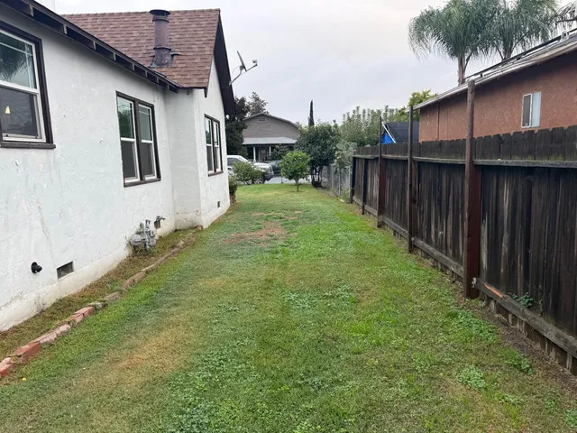 a backyard of a house with lots of green space
