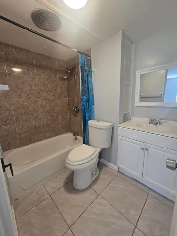 a bathroom with a toilet sink shower and bathtub