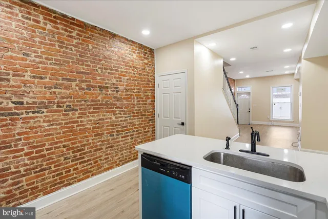 a bathroom with a sink and a large mirror