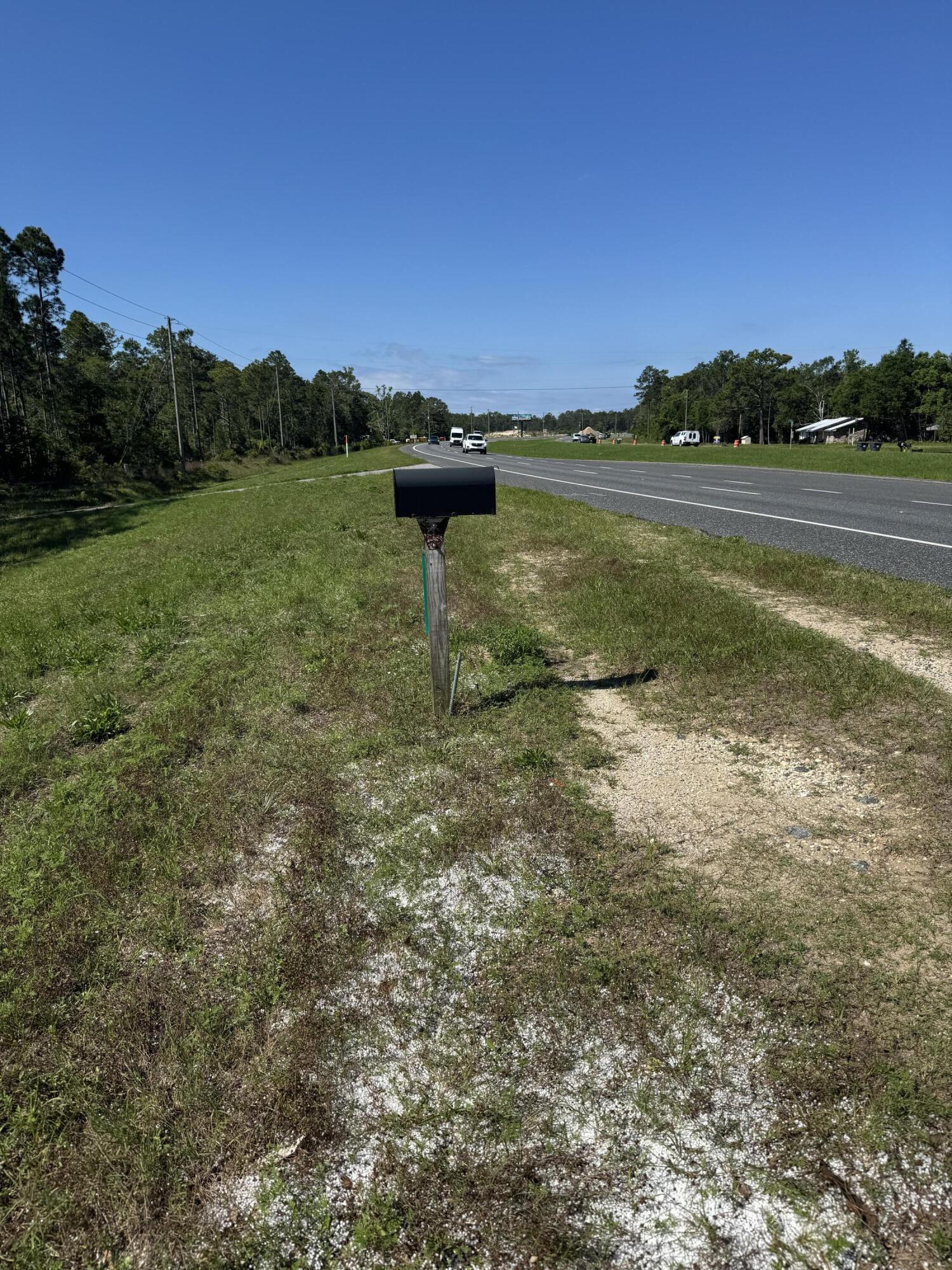 19121 Highway 331 Freeport, FL 32439 - Photo 3 of 4 a view of a lake with houses in the back