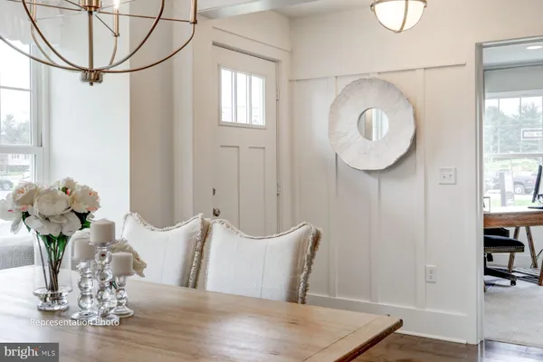 a bedroom with a bed a lamp and a window