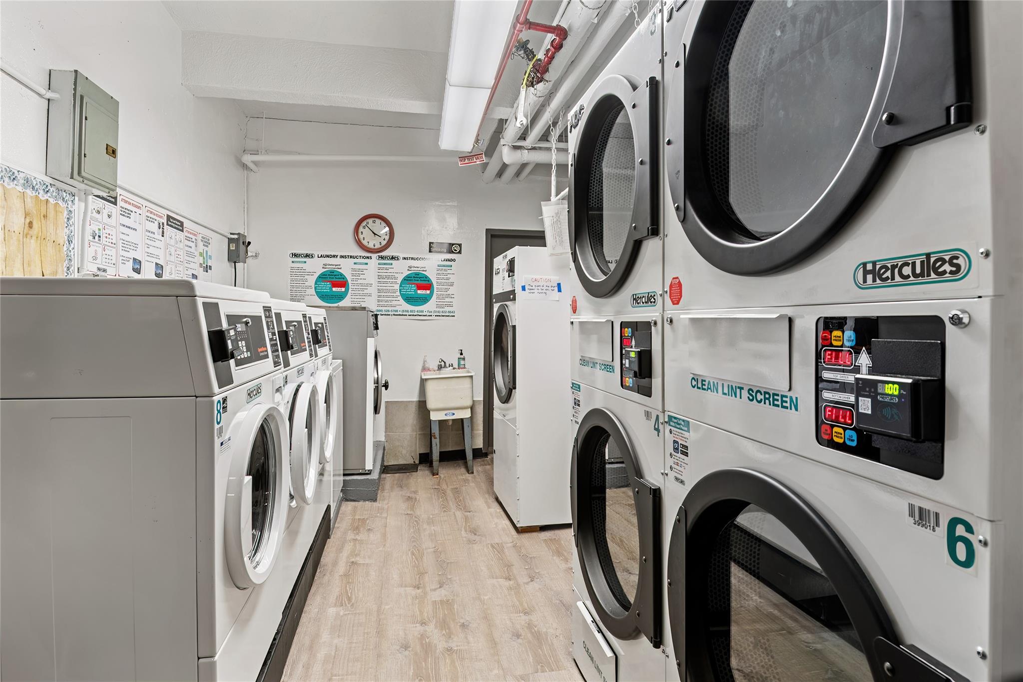 4265 Webster Avenue, Unit 7D Bronx, NY 10470 - Photo 14 of 14 a utility room with dryer and washer