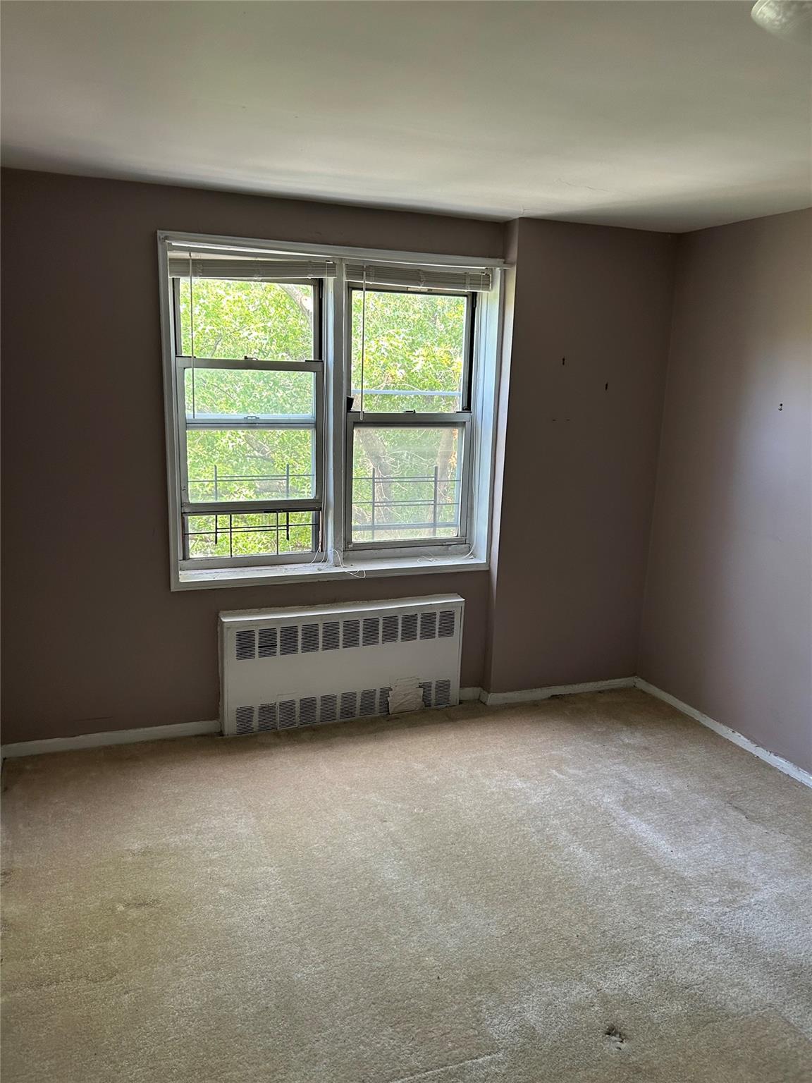 4265 Webster Avenue, Unit 7D Bronx, NY 10470 - Photo 10 of 14 an empty room with a window