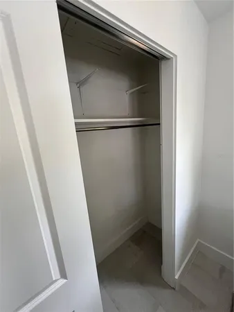 a bedroom with a bed and a tv