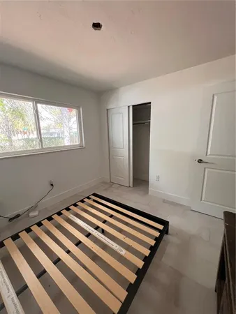 a view of kitchen with furniture and a window