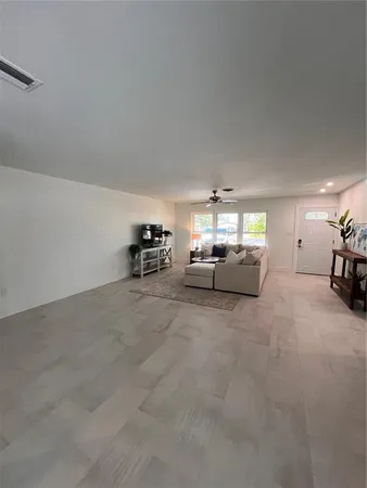 a view of livingroom with furniture and windows