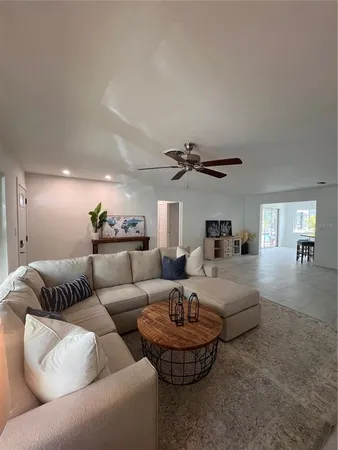a living room with furniture and a window