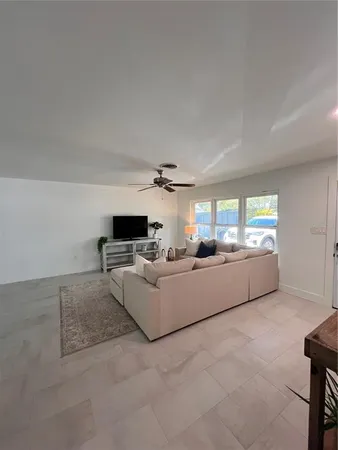 a view of a livingroom with furniture and windows