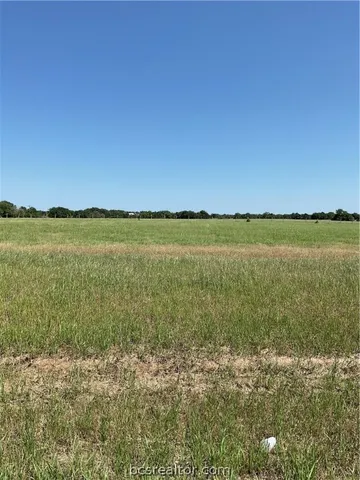 a view of an ocean beach and a mountain view