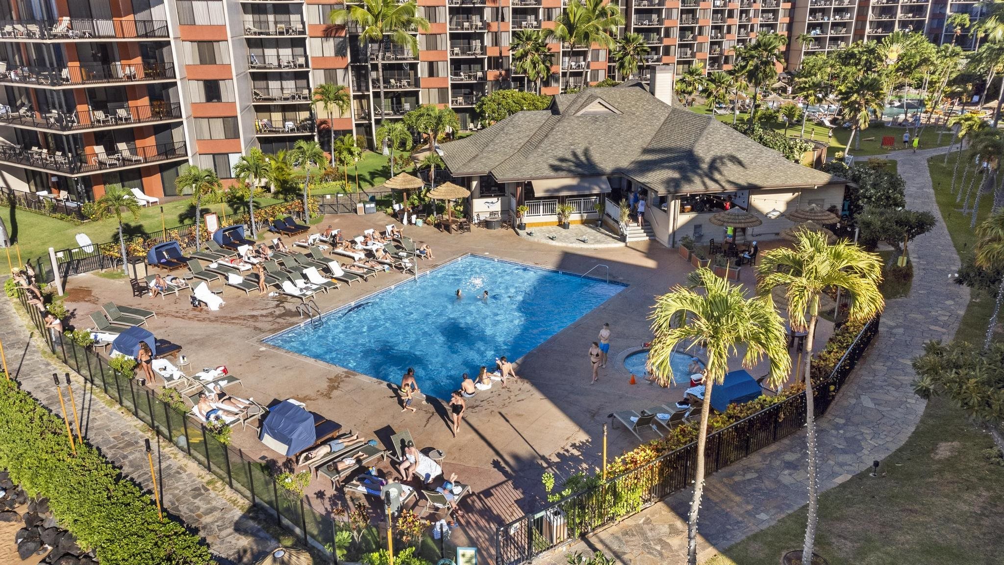 3445 Lower Honoapiilani Road, Unit 431 Lahaina, HI 96761 - Photo 15 of 32 an aerial view of a swimming pool with outdoor seating
