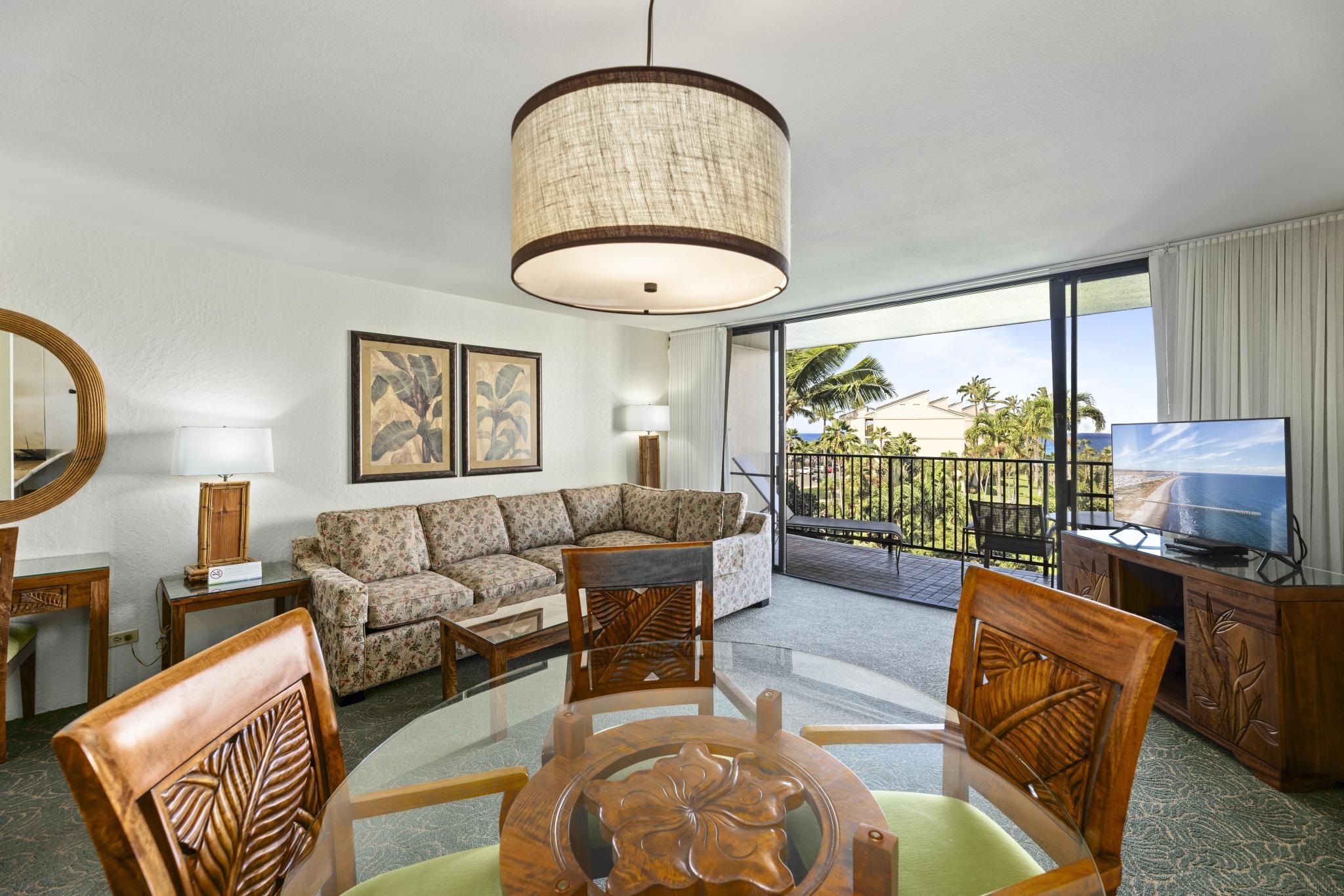 3445 Lower Honoapiilani Road, Unit 431 Lahaina, HI 96761 - Photo 4 of 32 a living room with furniture and a floor to ceiling window