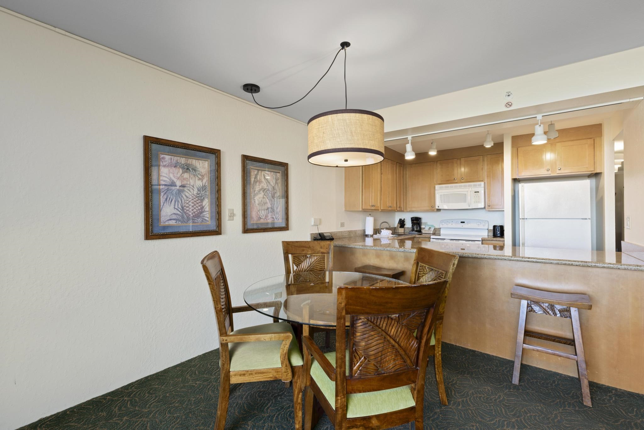 3445 Lower Honoapiilani Road, Unit 431 Lahaina, HI 96761 - Photo 6 of 32 a view of a dining room with furniture window and wooden floor