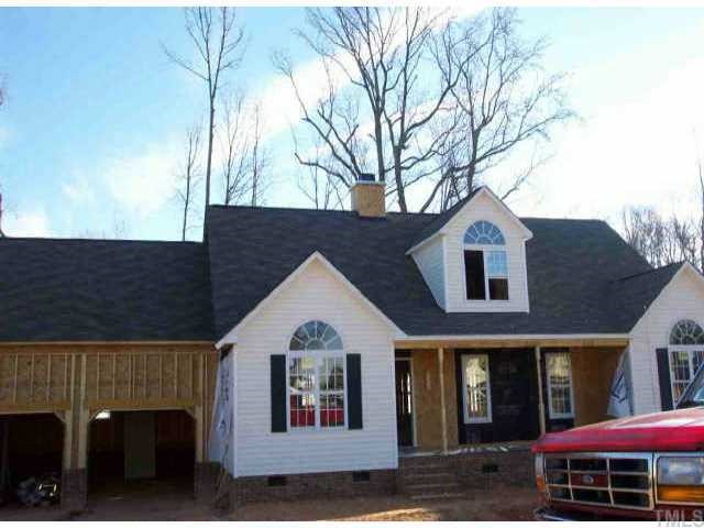 8517 Ridgebury Road Raleigh, NC 27603 - Photo 1 of 1 a front view of a house with a yard