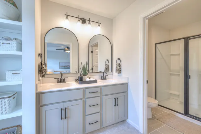 a bathroom with a double vanity sink and mirror