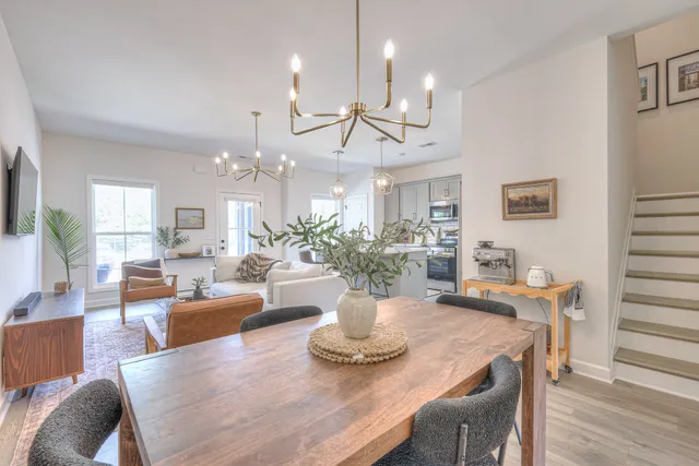 a view of a dining room with furniture and wooden floor