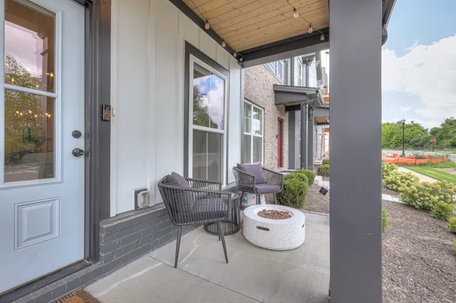 a view of a patio with couches and potted plants