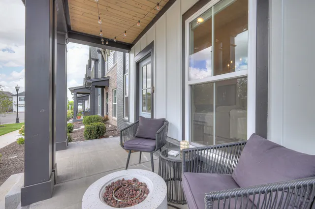 a outdoor living space with furniture and a rug