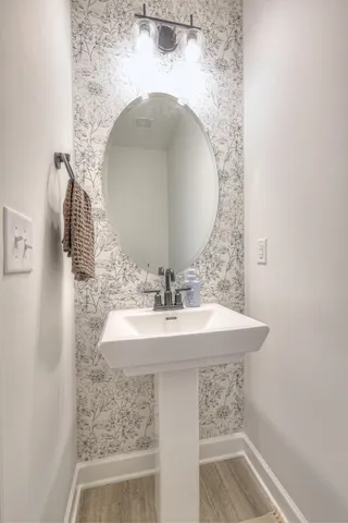 a bathroom with a sink and a mirror