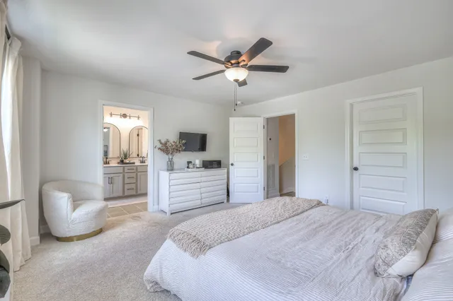 a bedroom with a large bed and closet