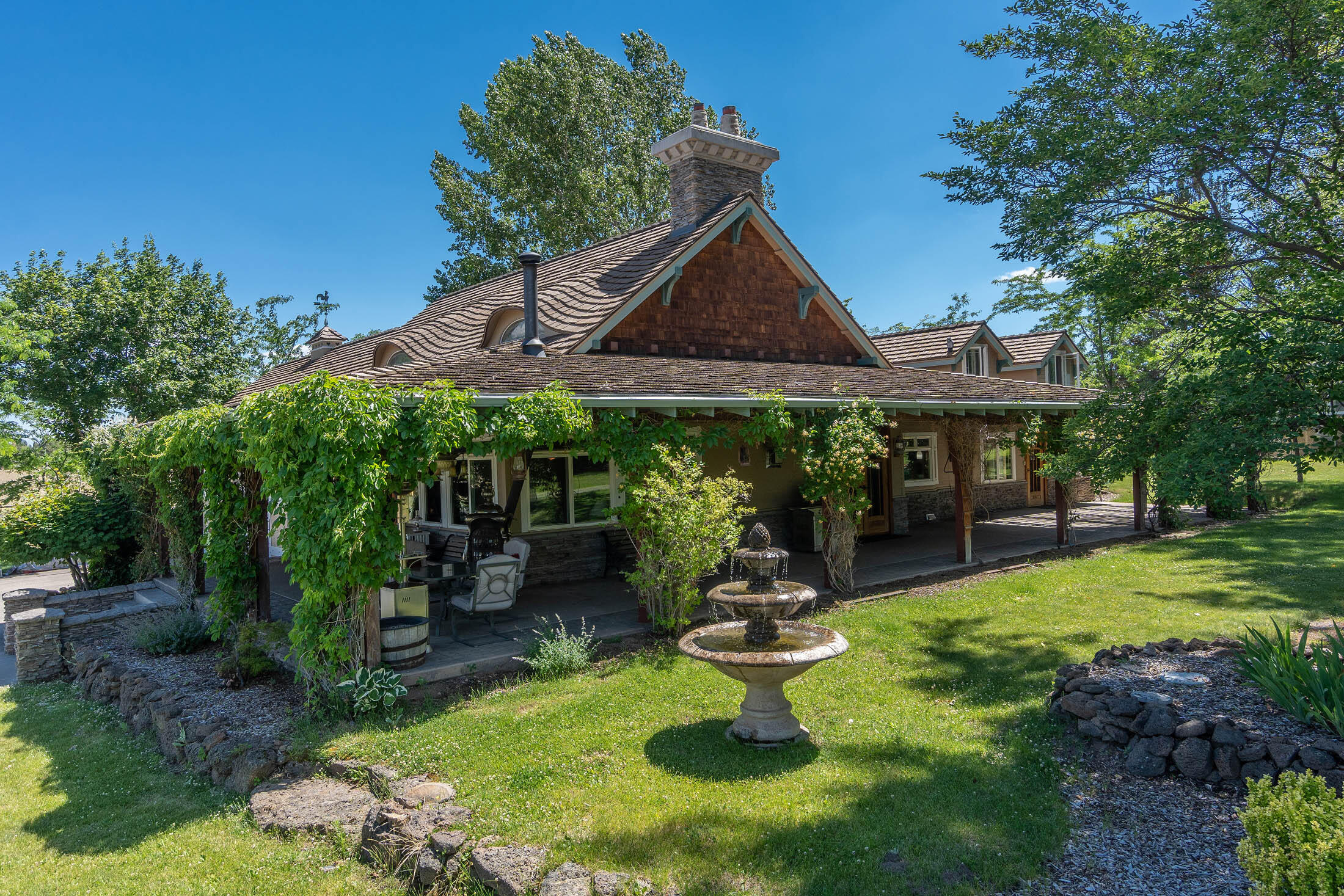21925 Bear Creek Road Bend, OR 97702 - Photo 57 of 104 a view of a house with pool porch and chairs